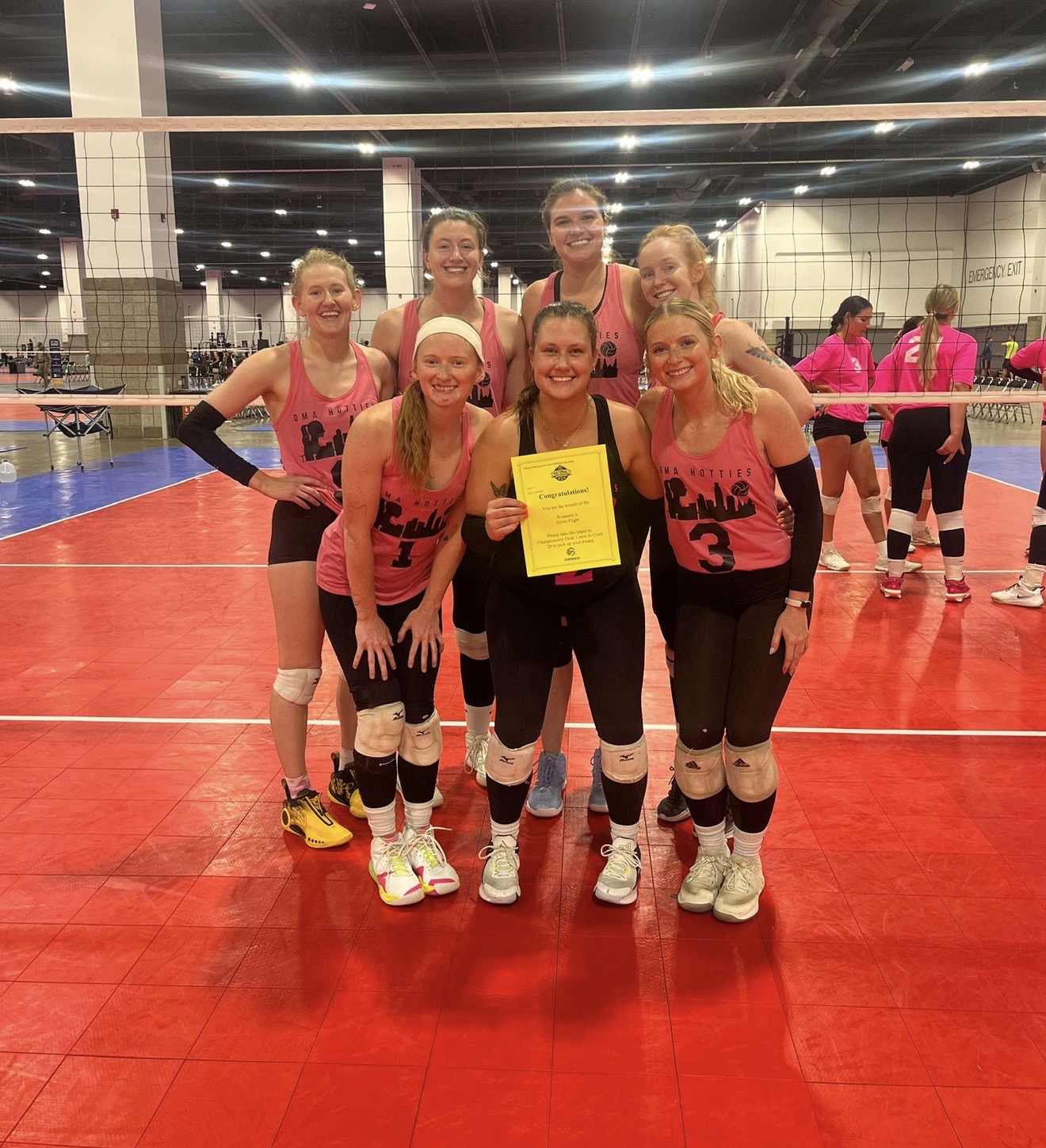 Omahotties team celebrating a tournament flight win