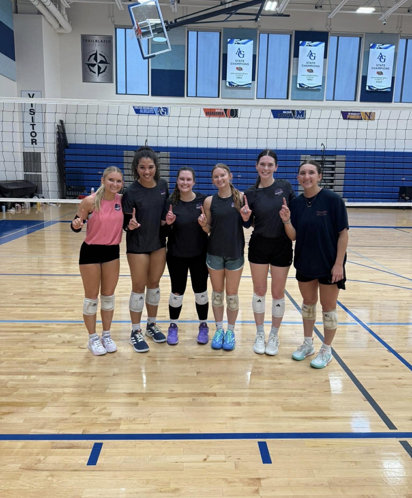 Omahotties squad on the indoor court after taking first