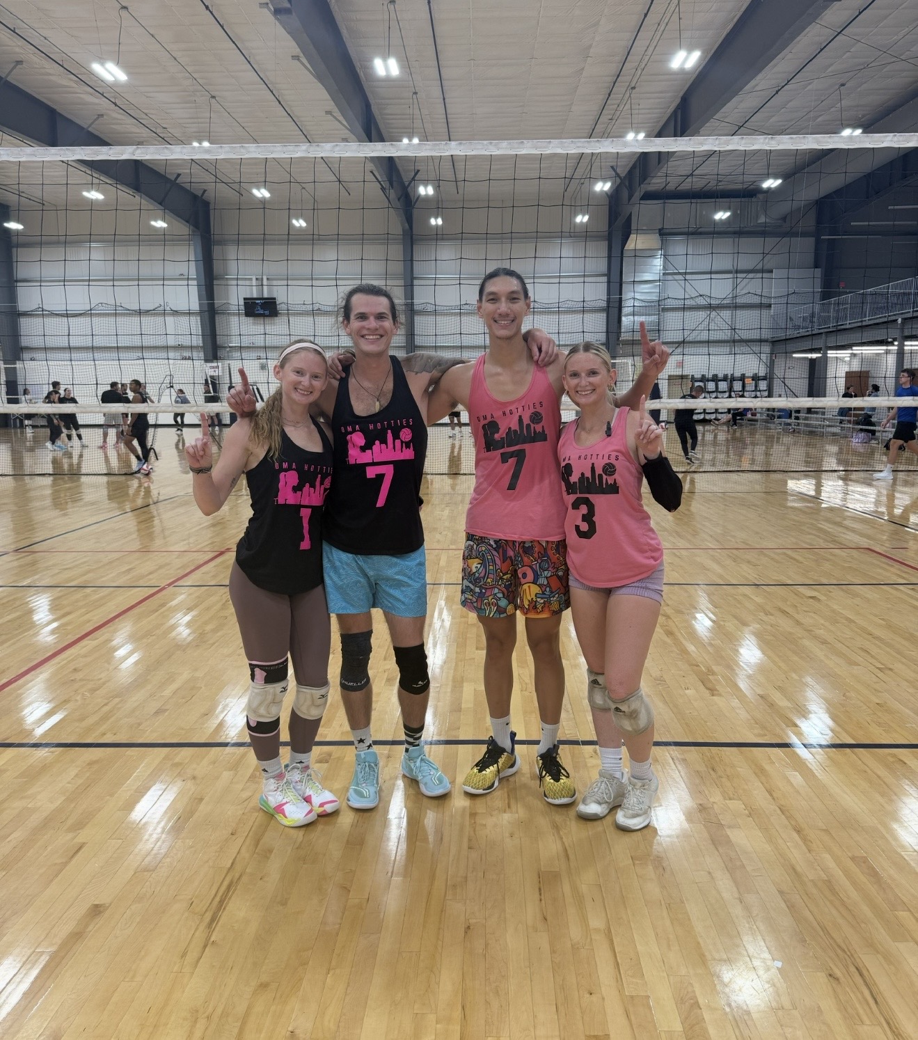 Omahotties co-ed team holding up number one after a win
