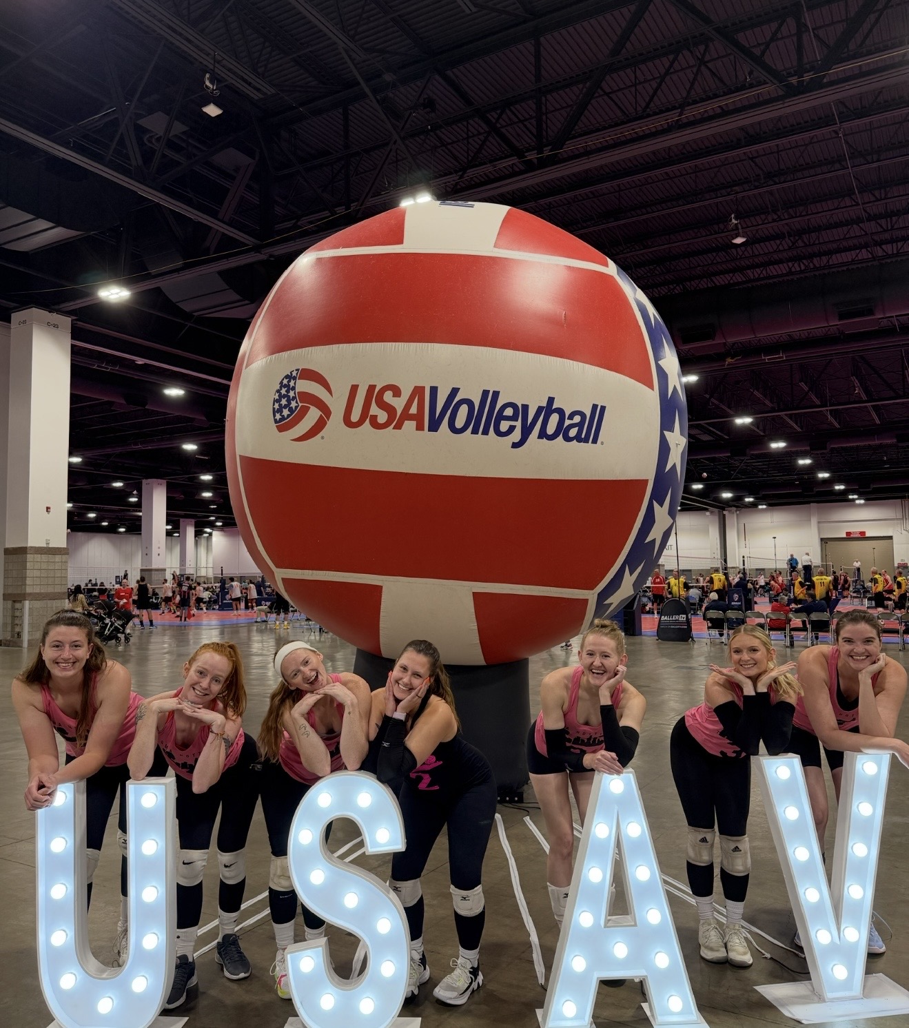 Omahotties posing with the giant USA Volleyball ball